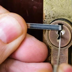 A,Man,Uses,Lockpicking,Tools,To,Pick,The,Lock,Of